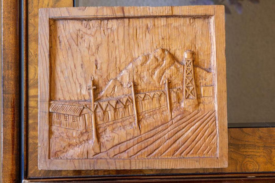 Paul’s grandfather carved the Poston barracks on some scrap wood from a fruit crate while incarcerated there.